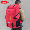 A red large capacity travel backpack is shown from the back, being worn by a person.