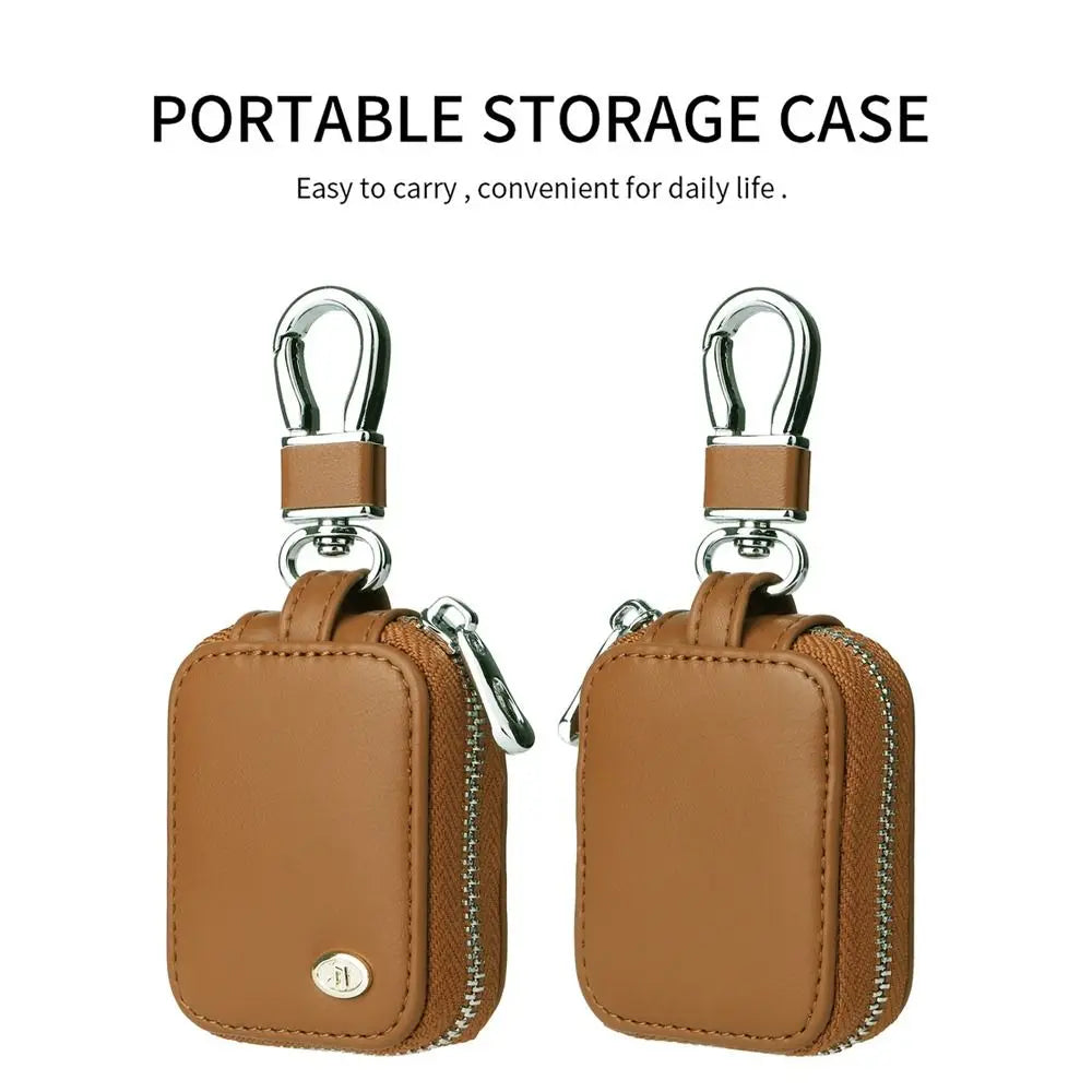 A pair of brown leather portable storage cases designed for protecting earphones.