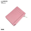 A pink genuine leather zipper card holder and coin purse.
