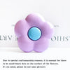 A soft purple flower shaped phone grip ring stand with small black dots on the surface.