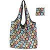 A foldable flower print tote bag featuring a pattern of various leaf colors.