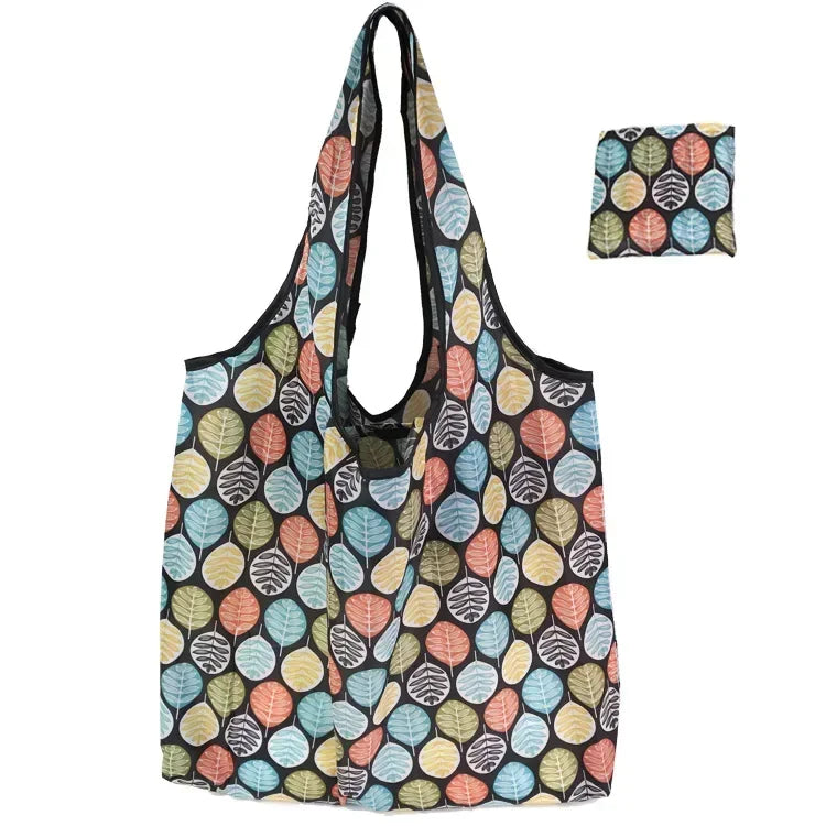 A foldable flower print tote bag featuring a pattern of various leaf colors.