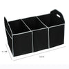 Black multi-pocket car trunk organizer with a foldable design and white trim.