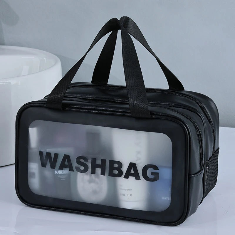 Black plastic toiletry bag with a clear window showing contents.