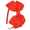 A bright red satin bow headband shown against a white background.