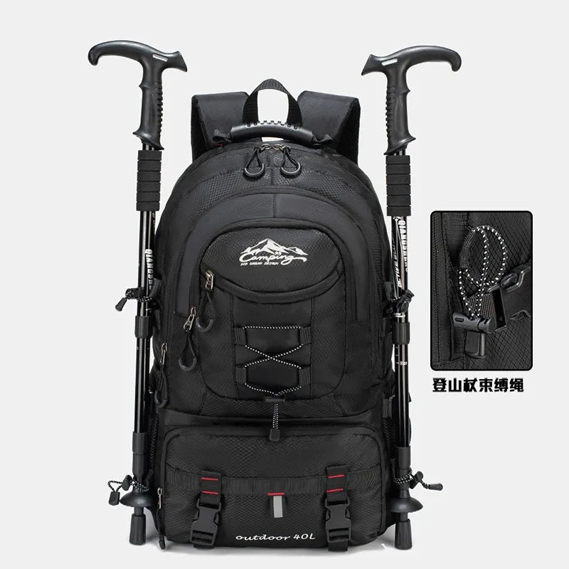 Black waterproof 40L hiking backpack with trekking poles and laptop sleeve