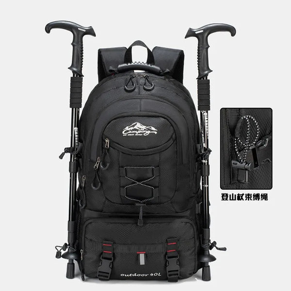 Black waterproof 40L hiking backpack with trekking poles and laptop sleeve