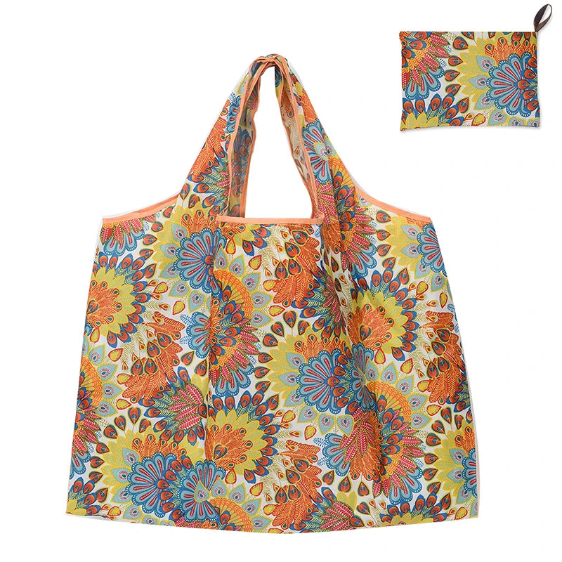A colorful floral patterned fabric shopping tote bag with a shoulder strap.