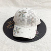 White floral mesh snapback baseball cap decorated with sparkling silver and pink embellishments