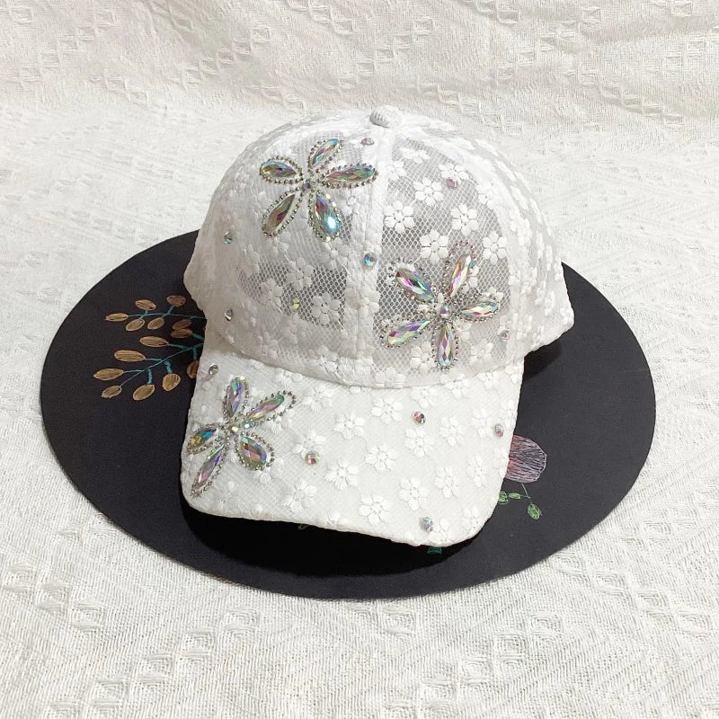 White floral mesh snapback baseball cap decorated with sparkling silver and pink embellishments