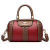 A maroon leather shoulder bag with gold hardware and a woven pattern on the front.