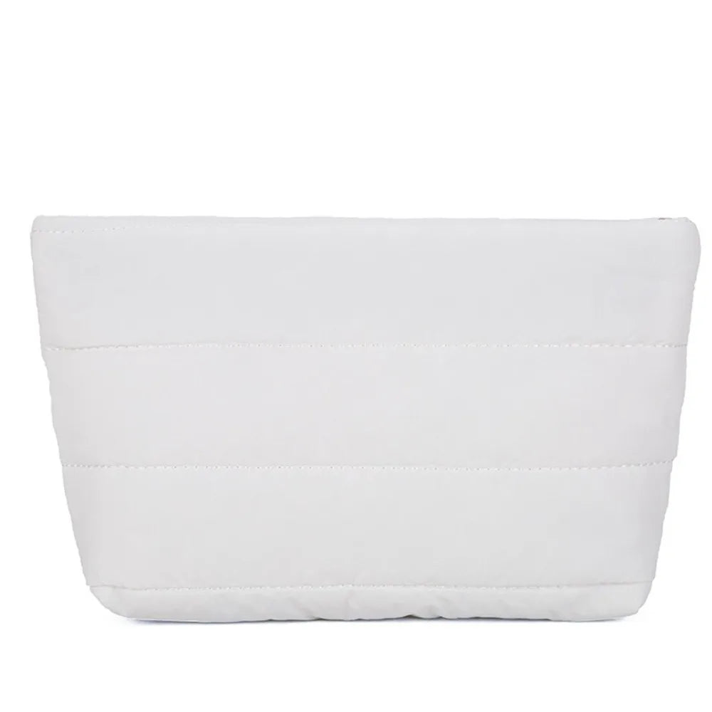 White quilted cosmetic travel bag with stitched lines.