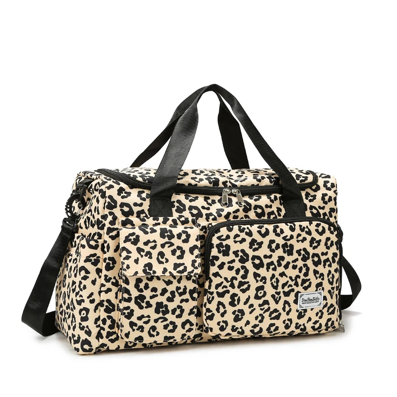 A beige and black leopard print travel duffel bag with handles and a shoe compartment.