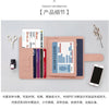 A pink slim PU leather wallet holding various cards and an ID, shown next to a smartphone.