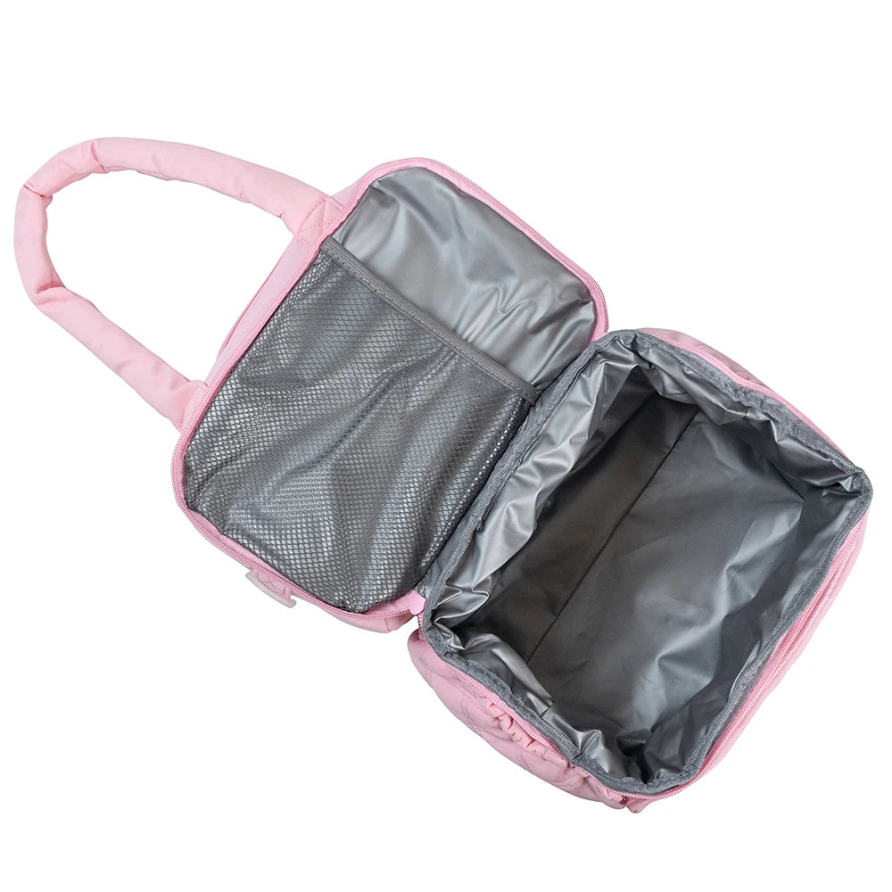 Pink insulated quilted lunch bag with a zippered compartment open to show the interior