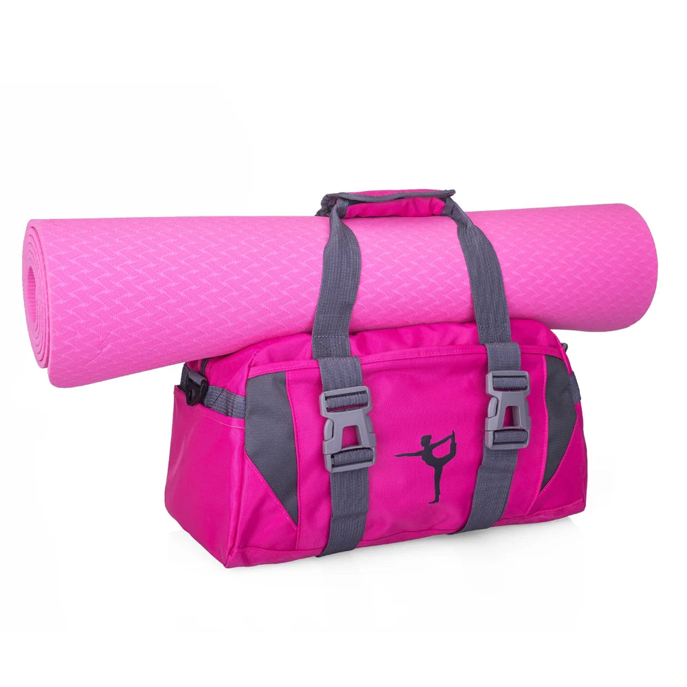 A bright pink rolled duffel bag with gray straps and buckles is shown lying on a white background.
