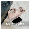 A pink retro PU leather shoulder bag is displayed next to a black accessory on a white background.