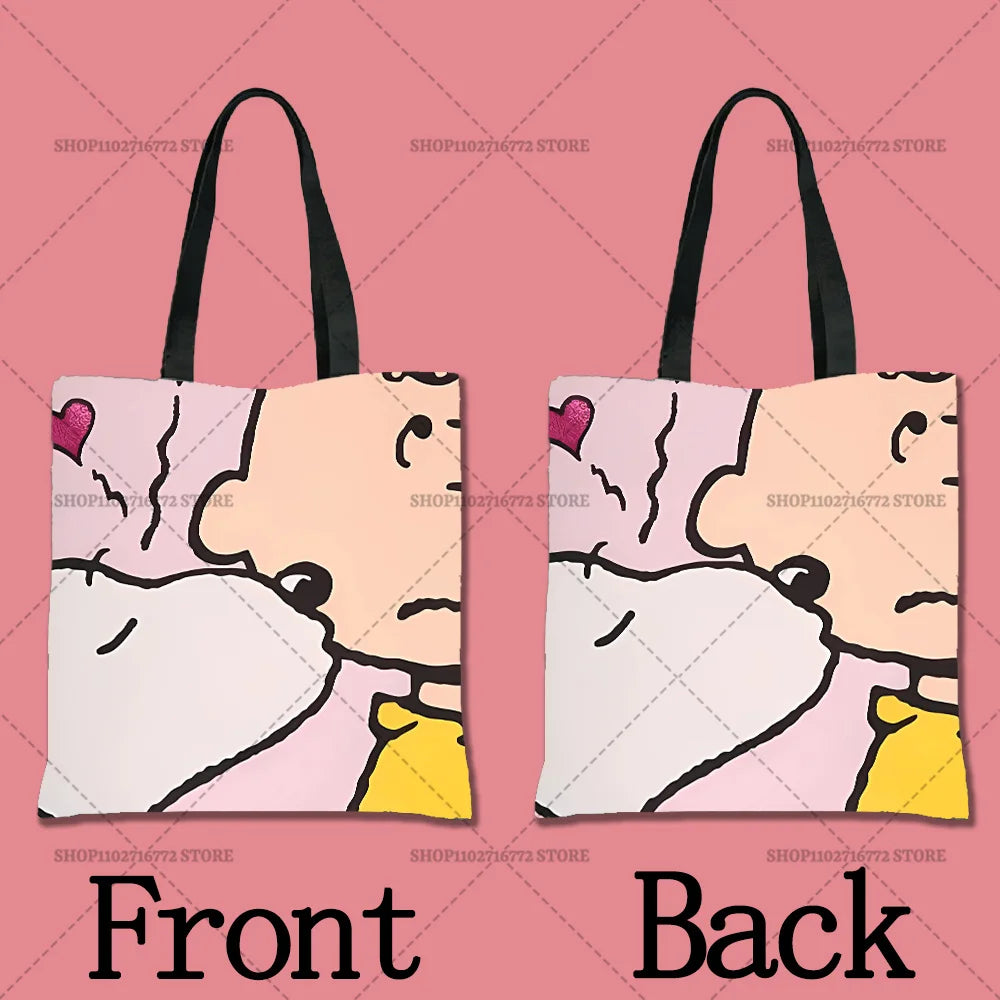 A pink cartoon illustration of a face with a white shirt and yellow collar on a tote bag, shown from the front and back.