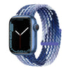 A blue braided stretch band worn around an Apple Watch face displaying a digital watch interface.