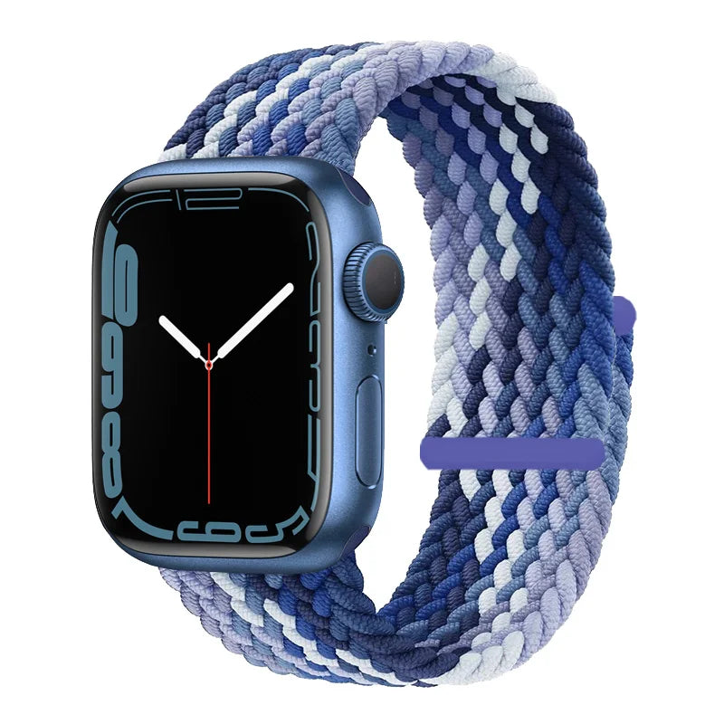 A blue braided stretch band worn around an Apple Watch face displaying a digital watch interface.