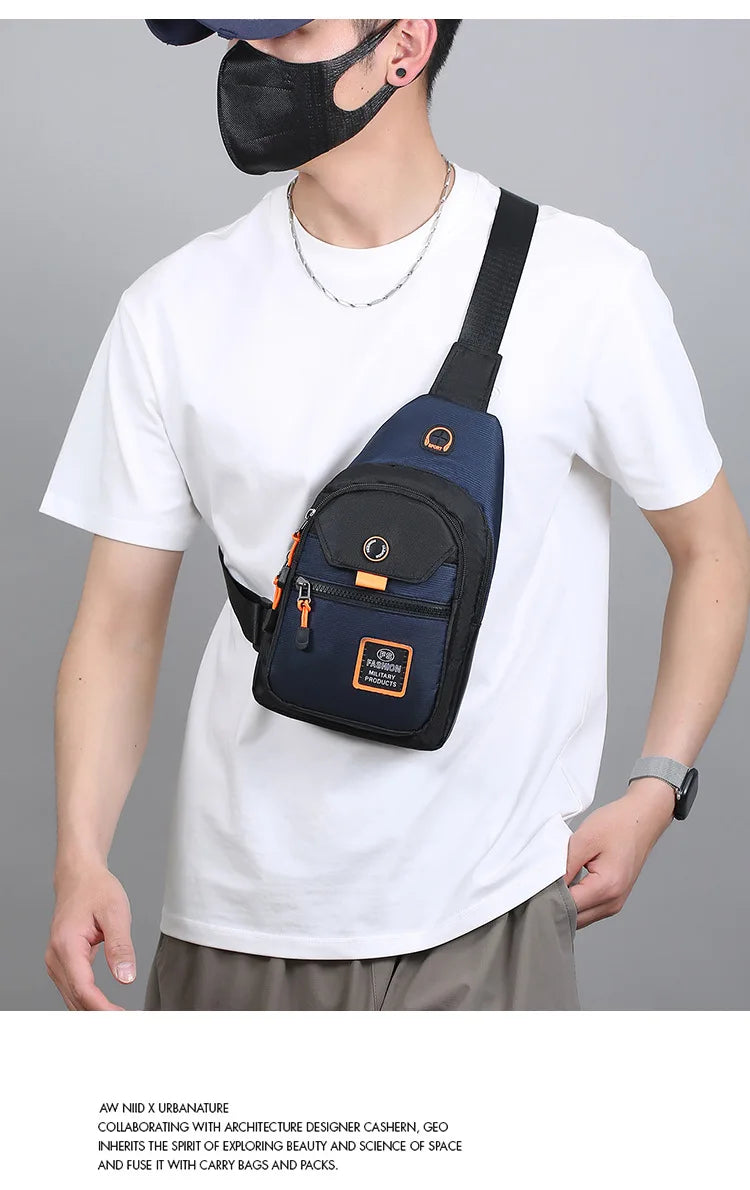 A man wearing a white t-shirt holds a navy blue compact oxford crossbody sling bag.