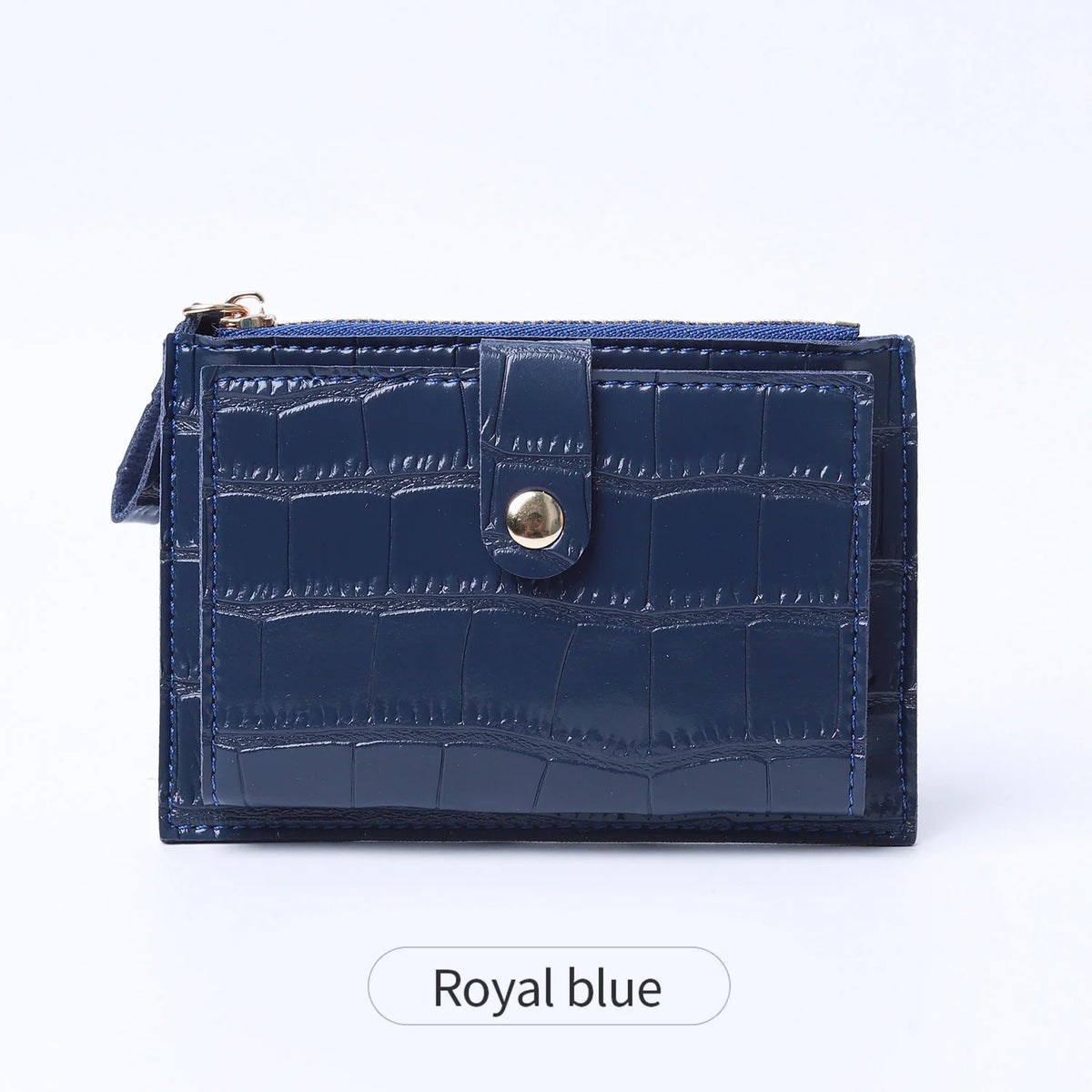 A royal blue mini crocodile pattern leather card holder with a zipper.