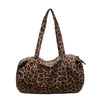 A brown leopard print canvas tote bag with an adjustable shoulder strap.