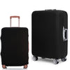 A black rolling suitcase with a protective dust cover and a pink handle.