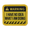A yellow and black warning patch with text that reads WARNING I HAVE NO IDEA WHAT I AM DOING