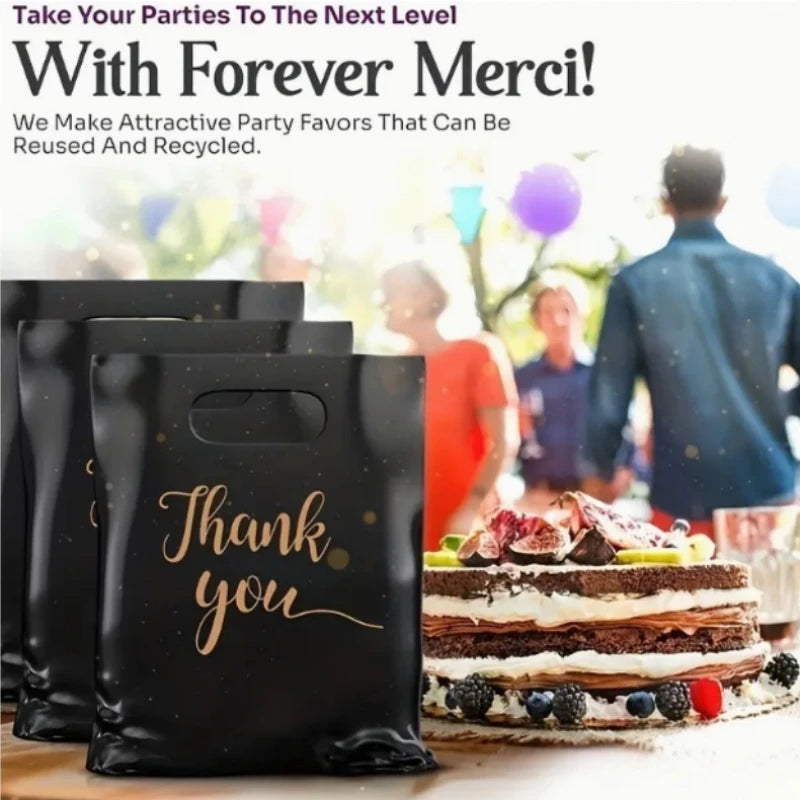 Black thank you gift bags with gold lettering displayed on a wooden surface.
