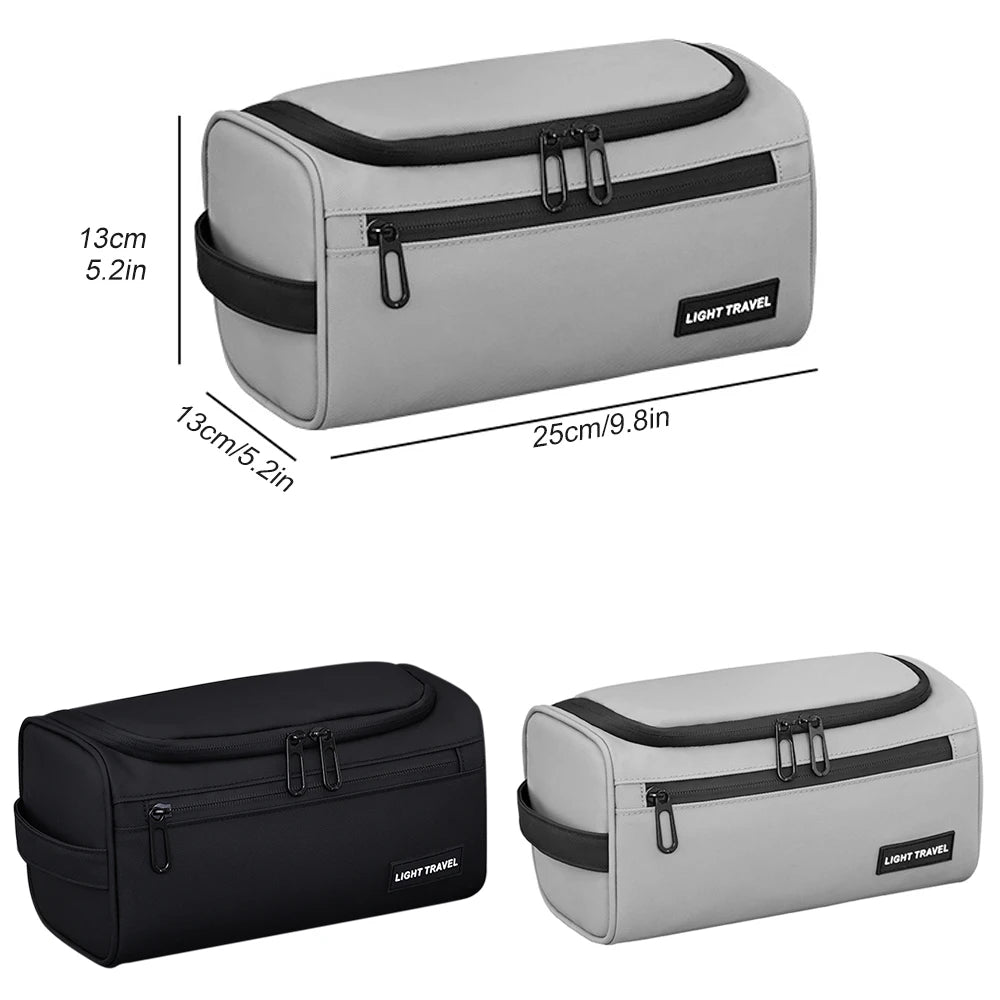 A light gray and black travel toiletry bag with a zippered compartment and buckles.