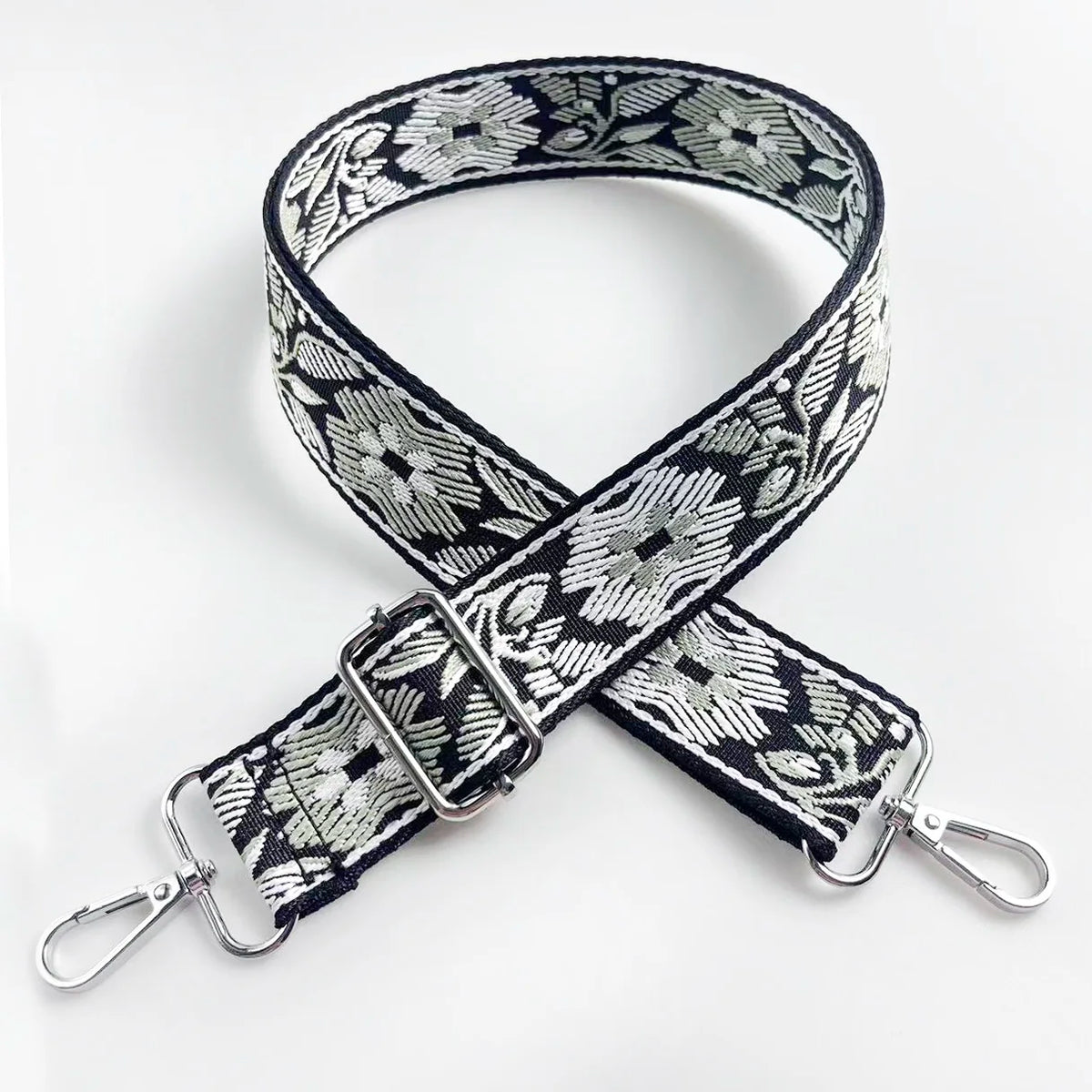 Black and white floral patterned adjustable strap for a crossbody bag