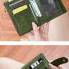 A close-up display of a green leather card holder wallet with gold accents, shown in various orientations.