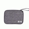 A gray travel cable organizer pouch with multiple storage compartments and a strap.