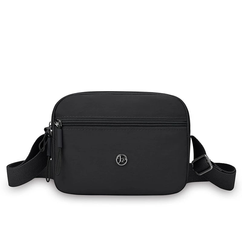 Black nylon crossbody bag with an adjustable wide strap.