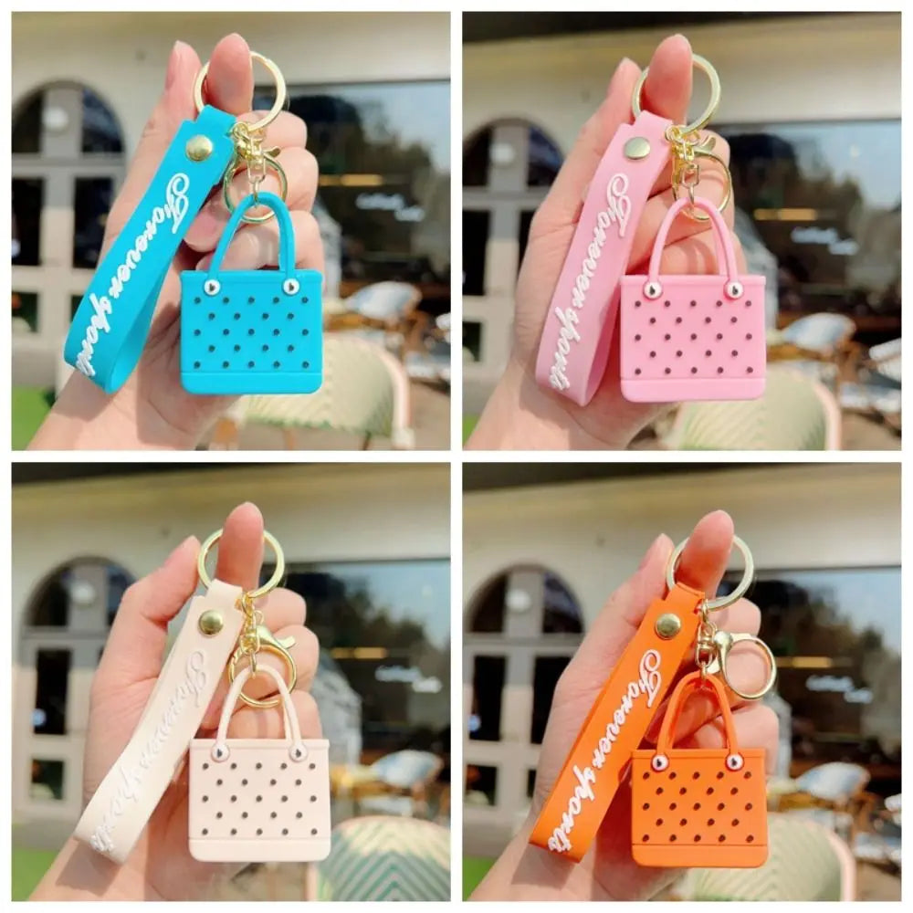 Four variations of a silicone heart beach bag keychain in various colors including blue, pink, and orange.