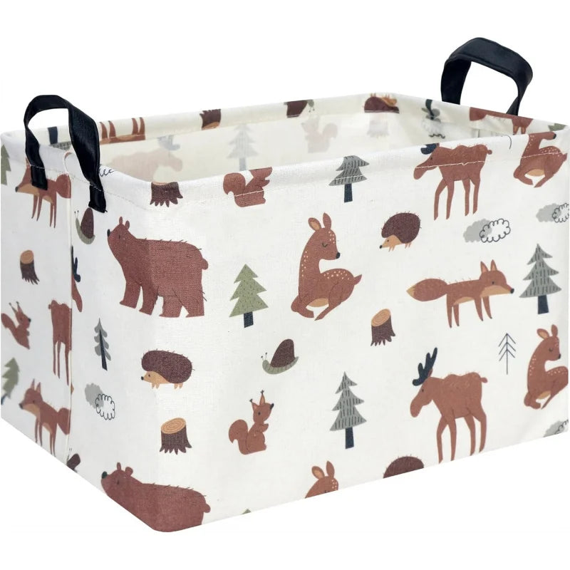A white fabric storage basket with black handles featuring a repeating pattern of woodland animals like deer and foxes.