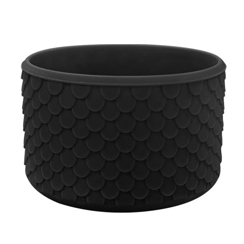 Black silicone boot sleeve for water bottles with a textured, scale-like pattern