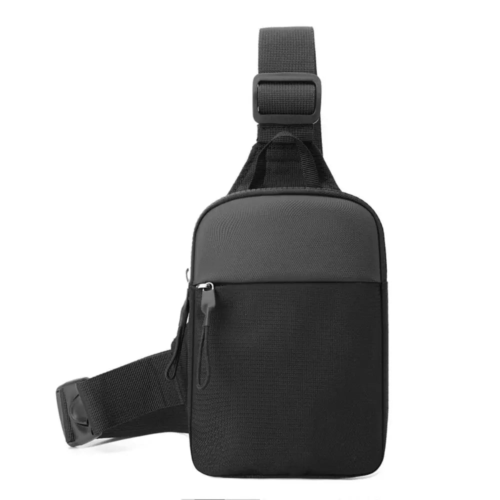 Black canvas crossbody sling bag with adjustable strap and flap closure