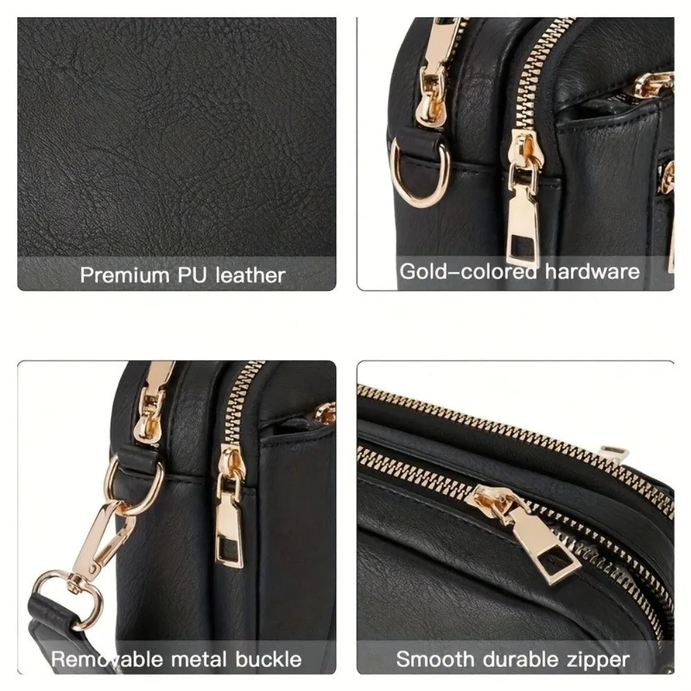 Close-up view of a black leather crossbody bag showing gold hardware, removable metal buckle, and smooth zipper details.
