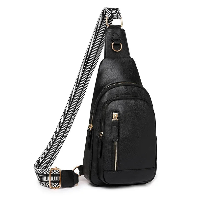 Black PU leather crossbody sling bag with a black and white striped strap