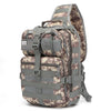 A camouflage patterned sling backpack with a flag patch on the front