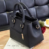 A black vintage PU leather tassel handbag is displayed on a wooden surface.