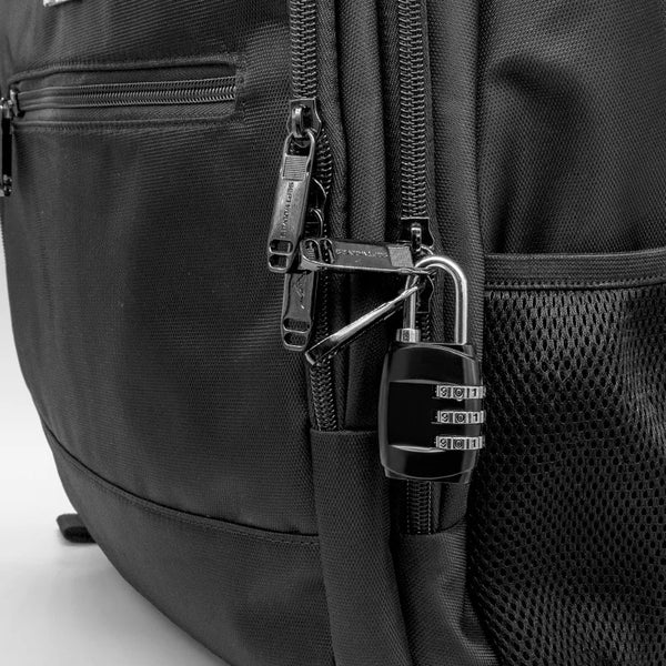 Close-up of a black luggage bag featuring a zippered pocket and a padlock attached to the zipper pull.