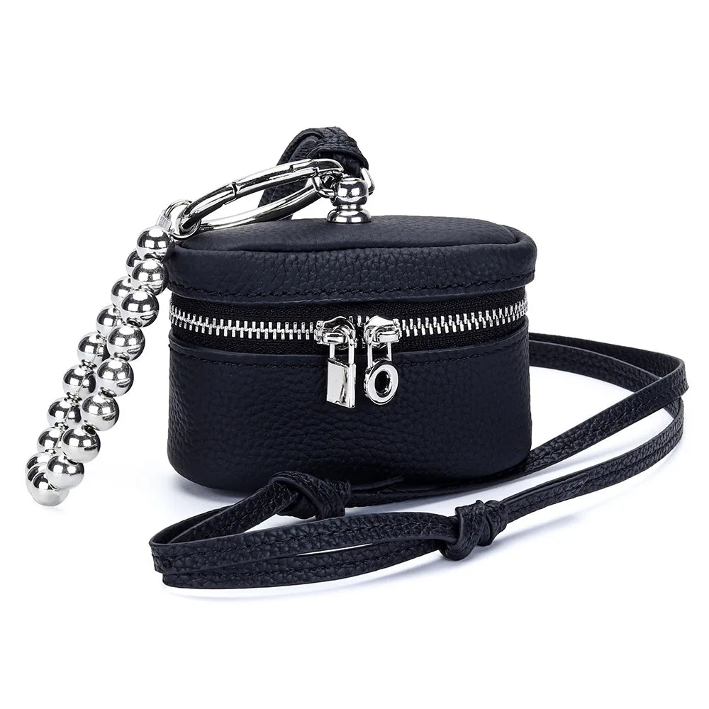 Black handcrafted leather coin purse with a silver chain and lanyard attached.