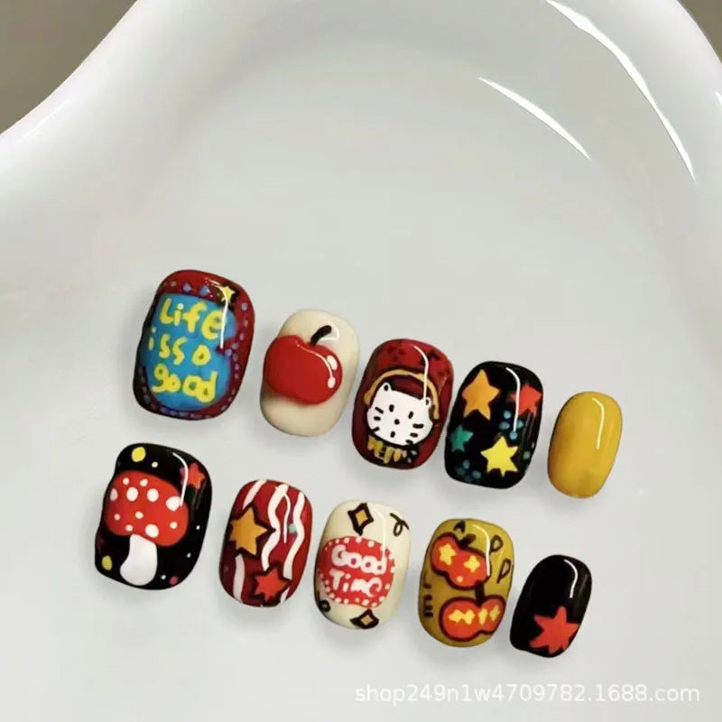 A collection of 30 cute cartoon press-on nails in various colors and designs displayed on a white surface.