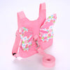 Rosa Kindersicherheitsgurt und Leine-Set mit rosa Stoff und aufgerollter Gurtschnur
