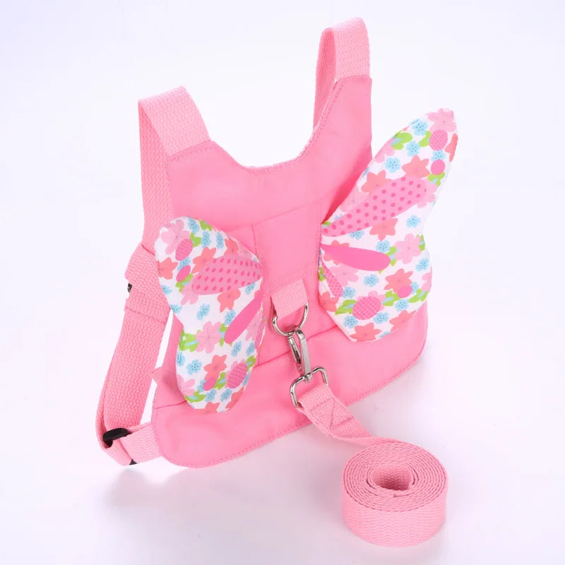 Rosa Kindersicherheitsgurt und Leine-Set mit rosa Stoff und aufgerollter Gurtschnur
