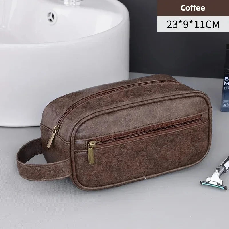A brown PU leather travel toiletry bag with organizer pockets is shown next to a white sink.
