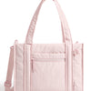 A light pink quilted tote bag with a detachable strap shown from the front.
